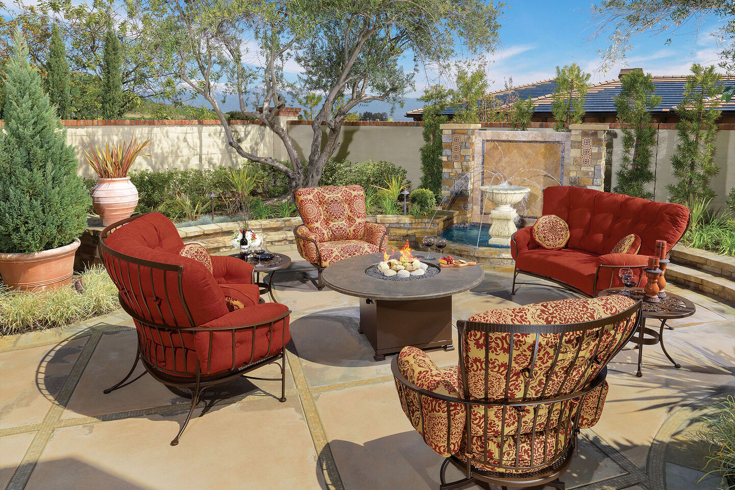 Monterra lounge collection with fire pit in sunny backyard