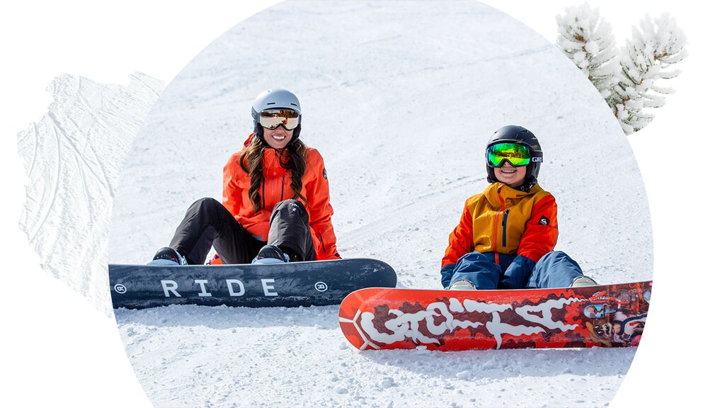 Mom and son snowboarding