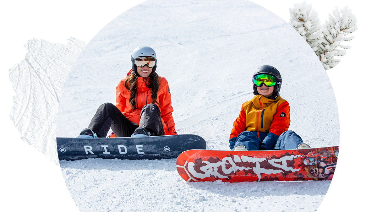 Mom and son snowboarding