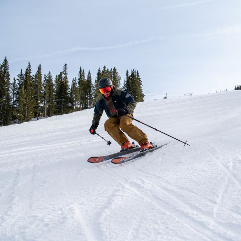 Kumar K carving on a ski slope