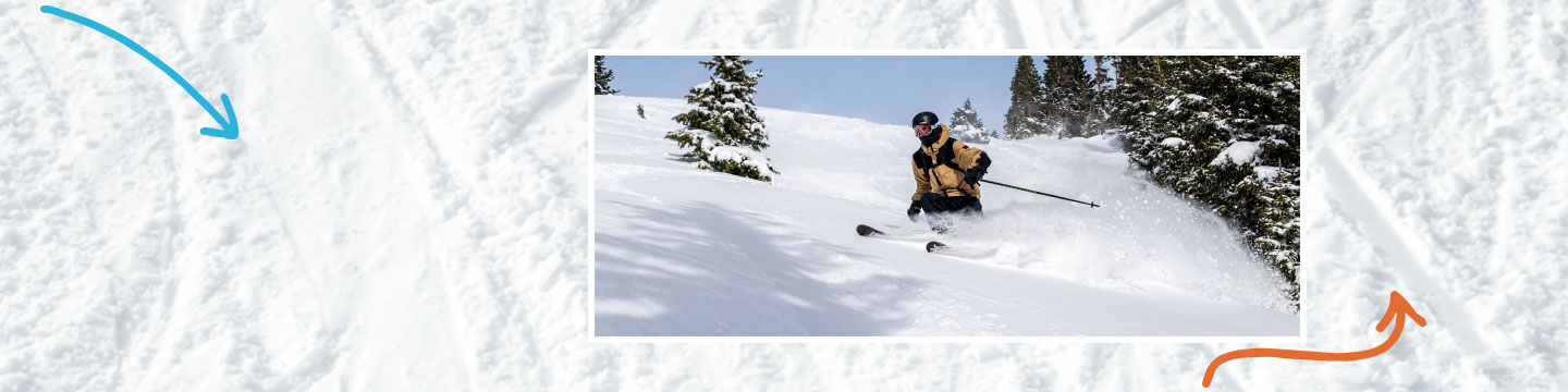 Skier in pow on a sunny day