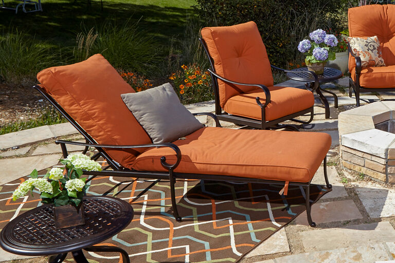 Hanamint Santa Barbara chaise lounger with orange cushions