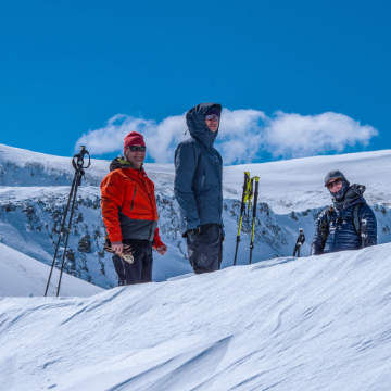 three backcountry skiers
