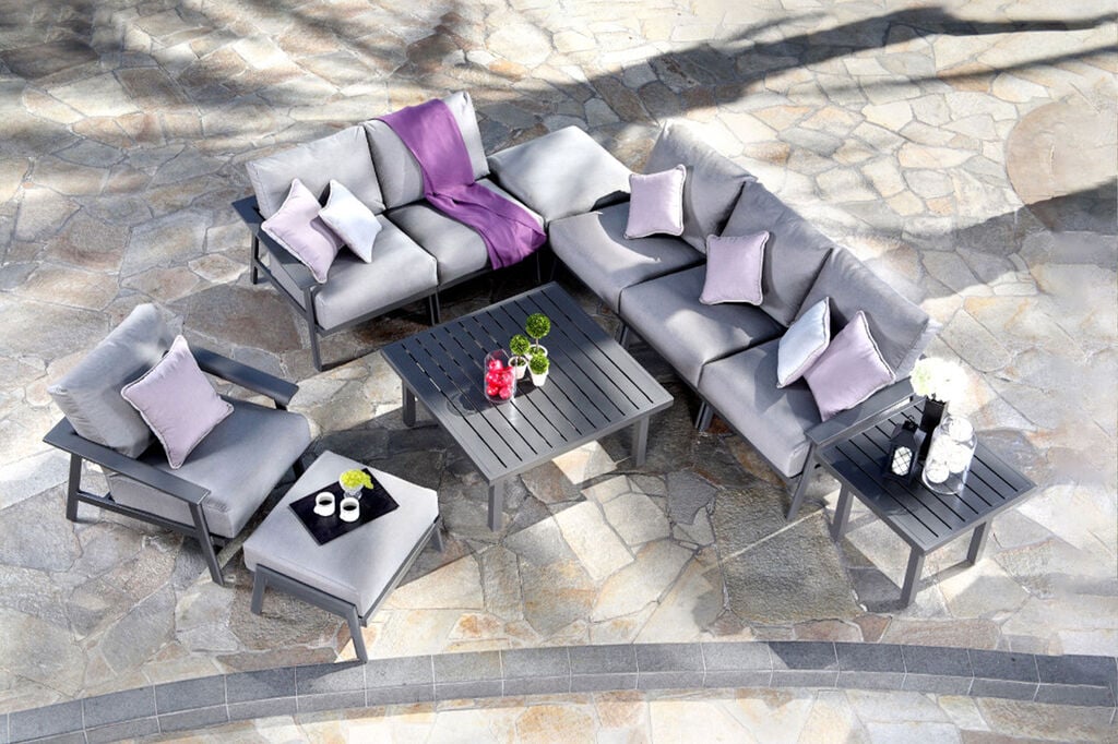 Dakoda by Mallin lounge furniture arrangement with tables and outdoor cushions
