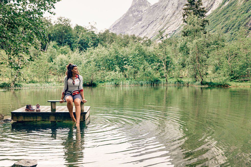 woman sitting on raft in a lake.