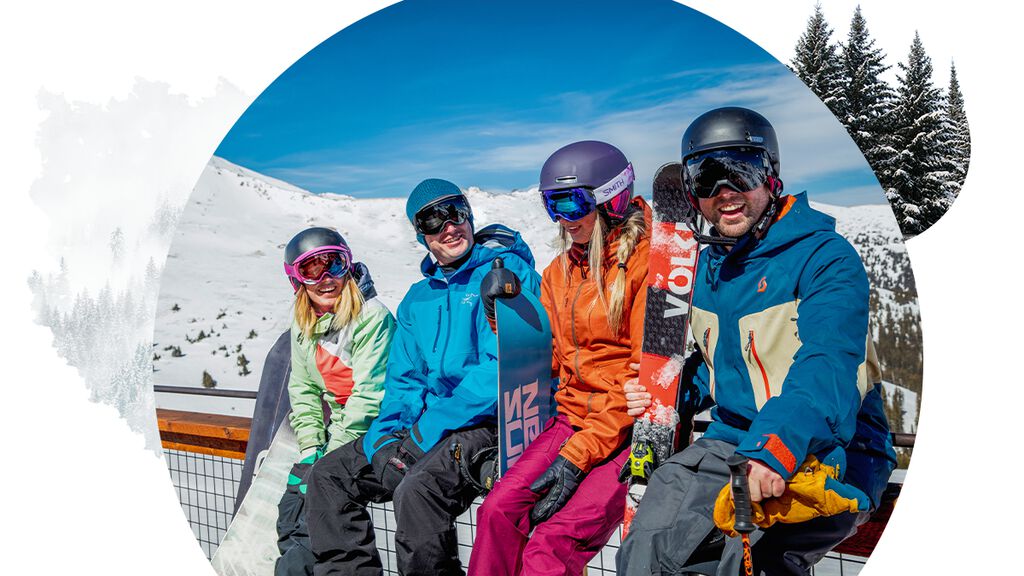 Group of skiers taking a break in the sun