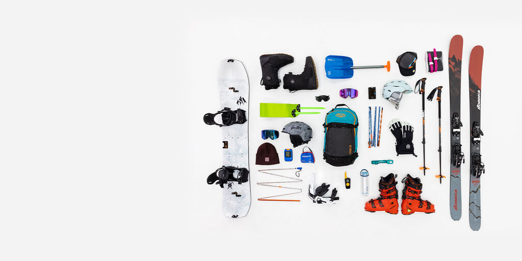 Backcountry skiing products laid out on the ground