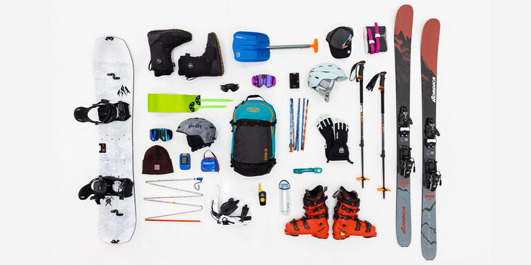Backcountry skiing products laid out on the ground