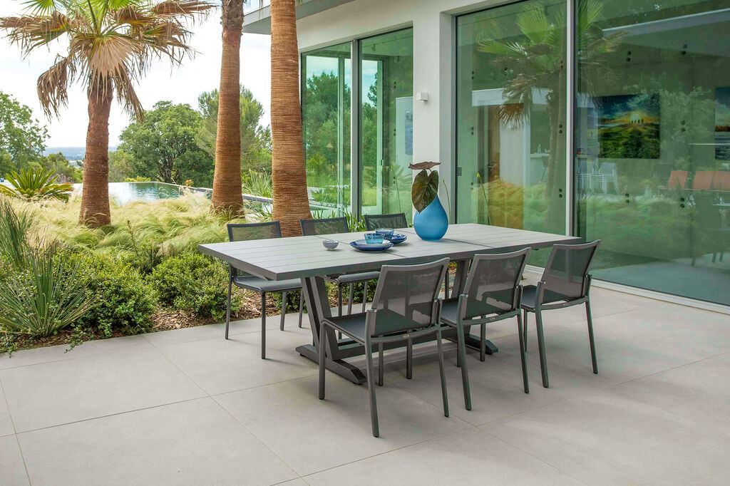 Amaka by Les Jardins dining furniture collection on concrete patio