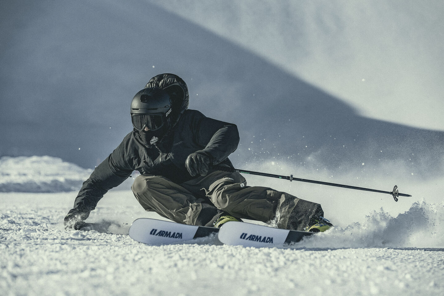 Two snowboarders riding on a sunny day