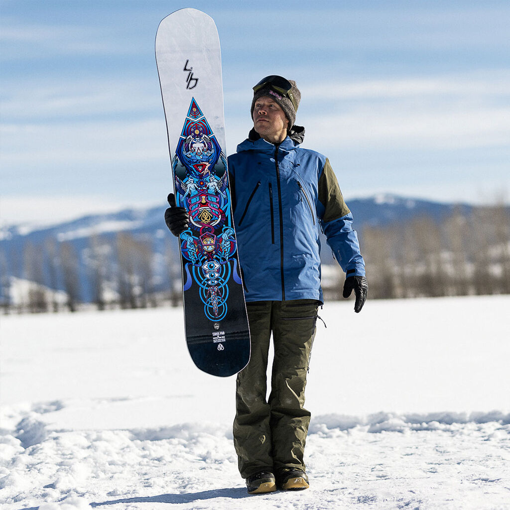 Man holding snowboard