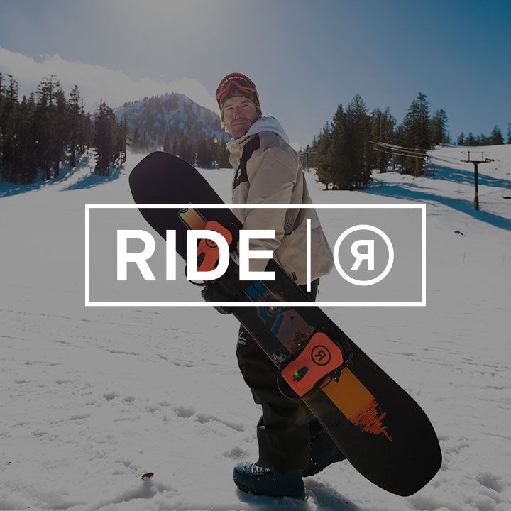 Man holding Ride snowboard