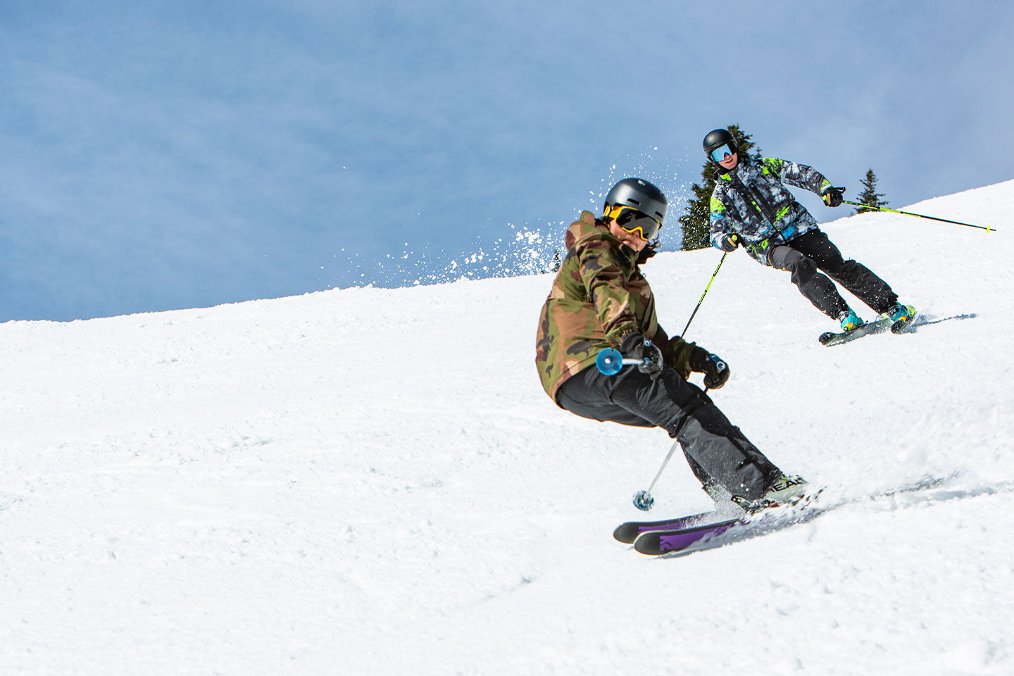 Two skiers having fun on the slopes