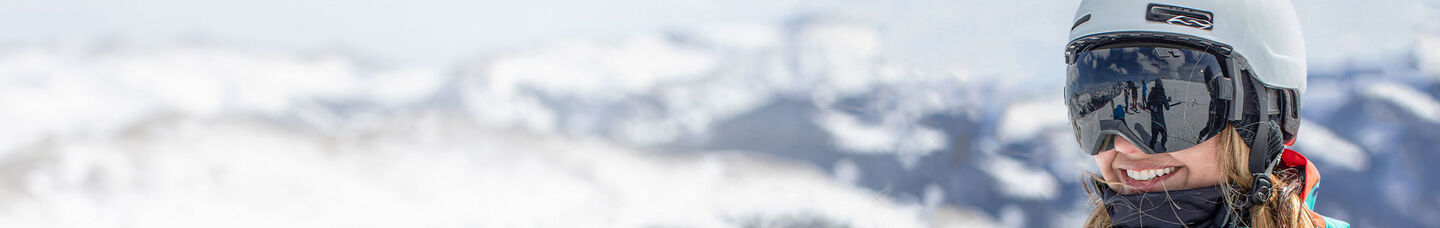 Happy smiling woman skier