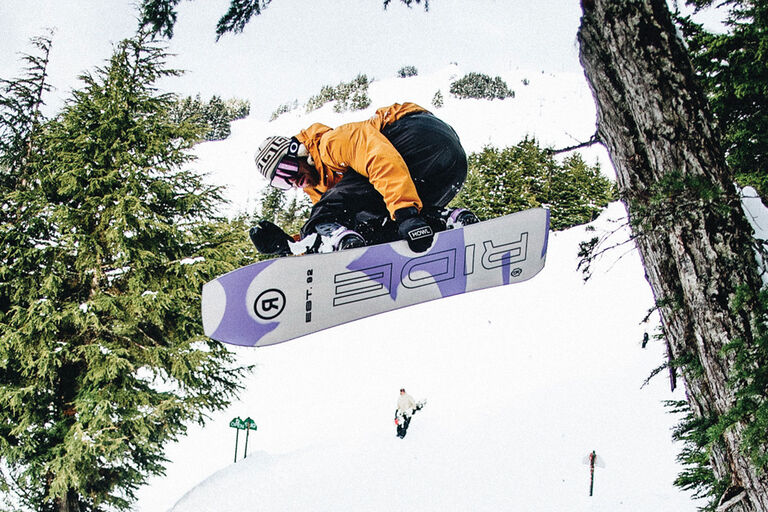 Snowboarder doing a grab