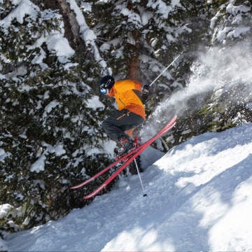 skier catching air on a side hit