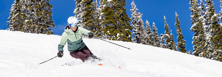 Tracy skiing on a sunny day