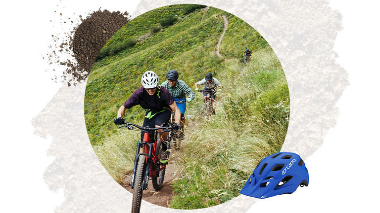 Group of mountain bikers outside on a winding trail