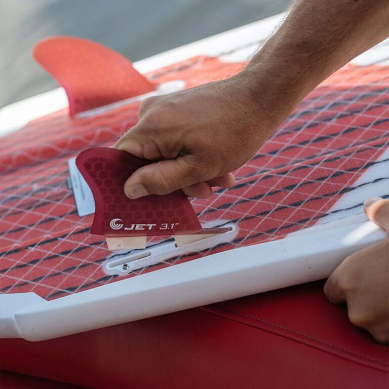 Installing fin on a surfboard