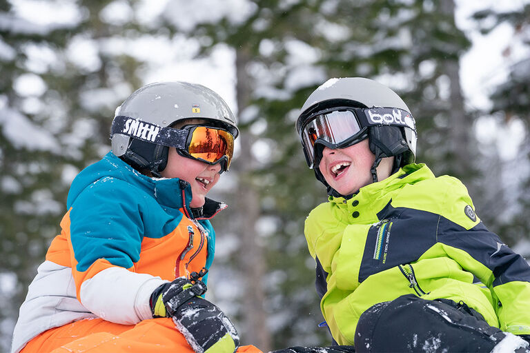 boys smiling and having fun a day at the mountain