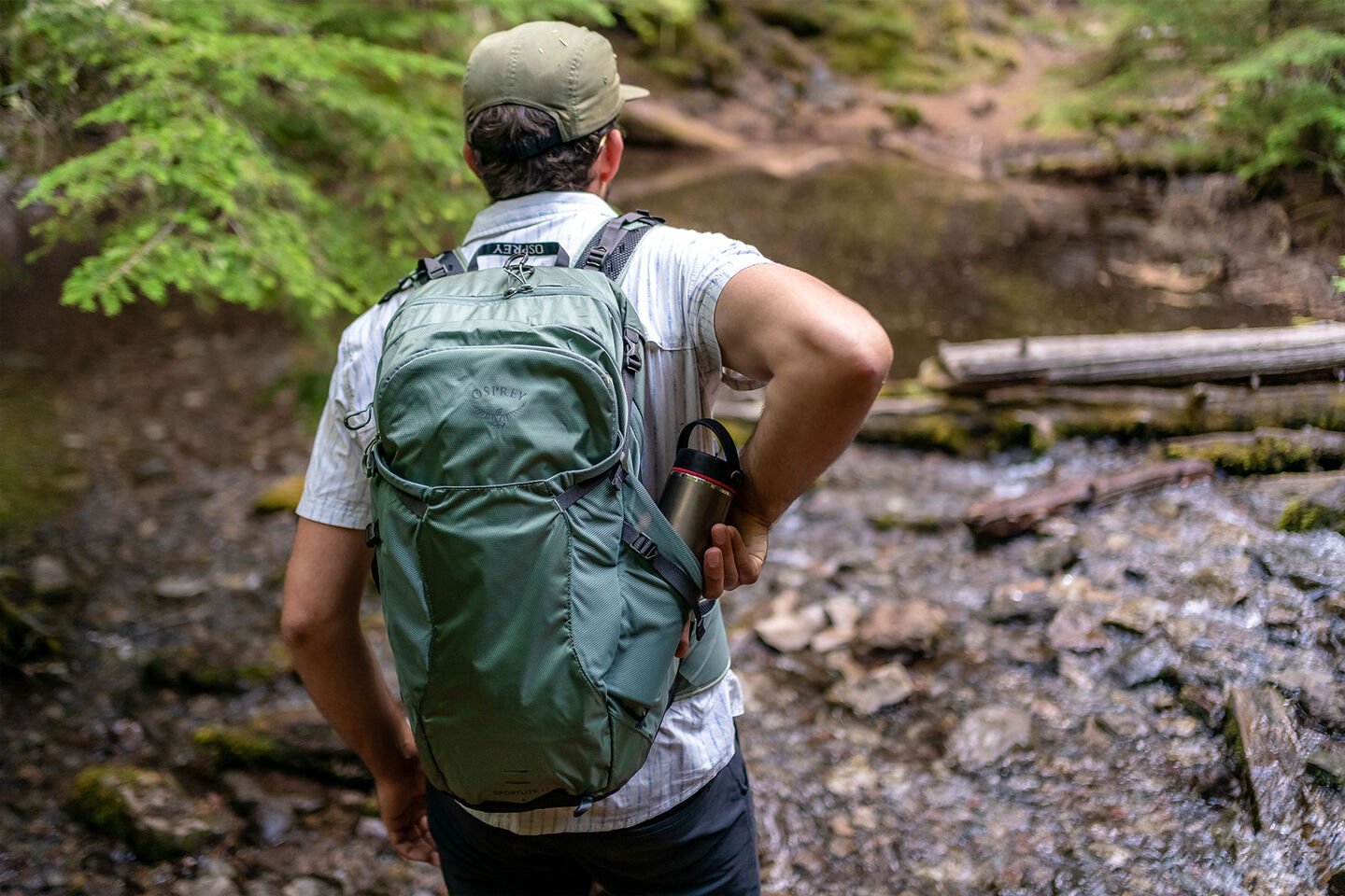 Man outside wearing a hiking pack by Osprey