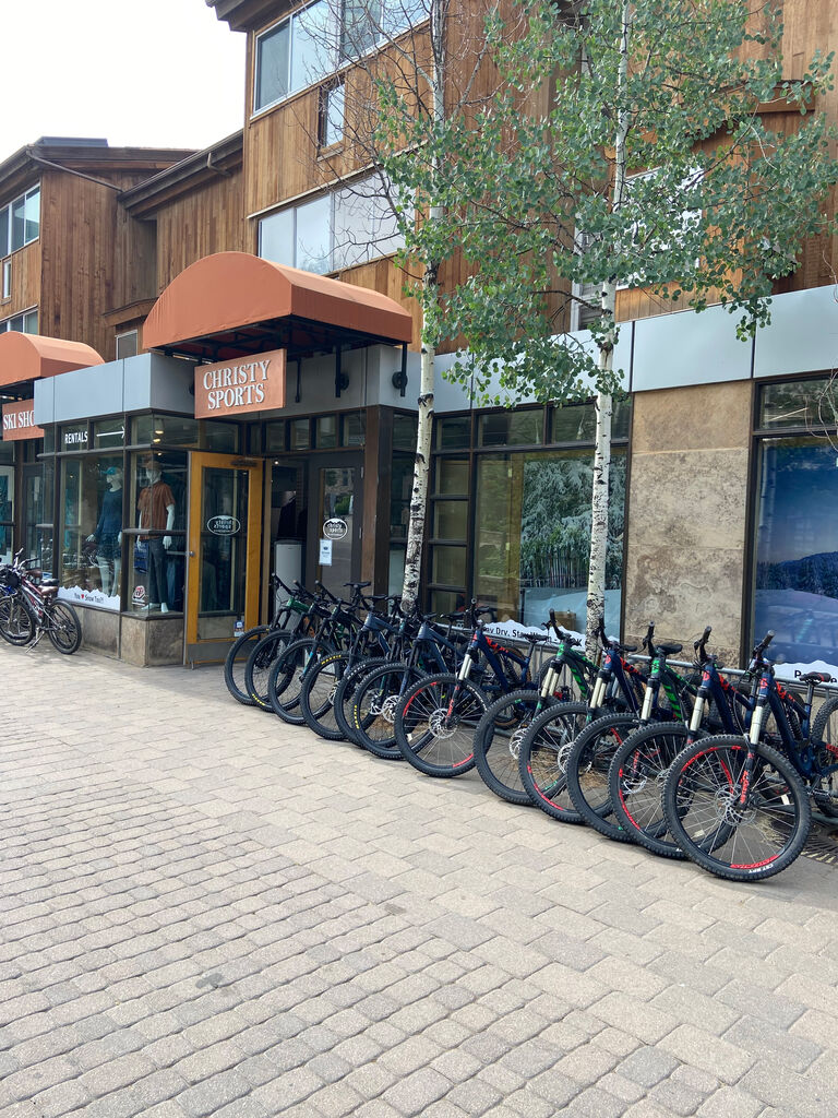 Christy Sports - Lionshead Village, Vail Storefront in the summer with rentable bikes out front