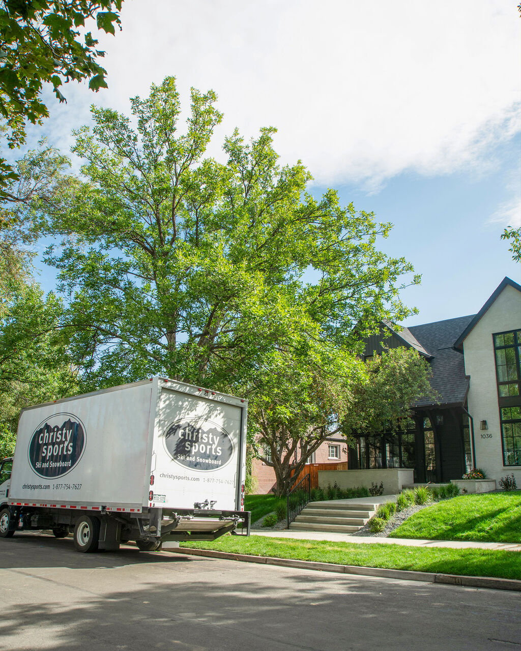 Christy Sports truck delivering outdoor furniture to residential property