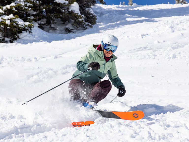 Tracy ripping turns on a sunny day