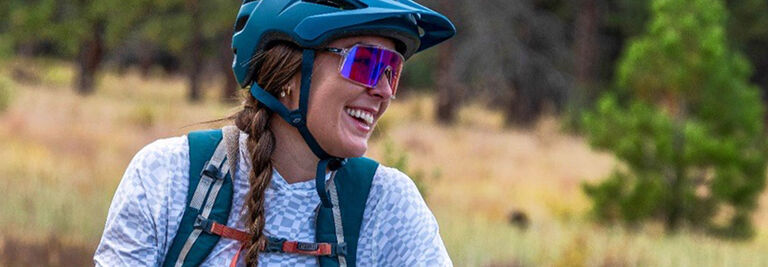 Clare smiling wearing mountain biking gear