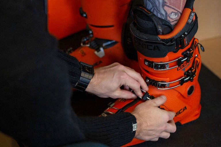 Close up of ski boot being fit