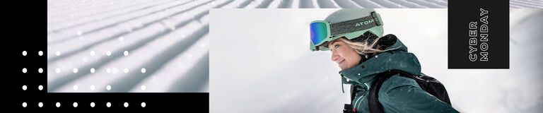 Woman in ski gear looking at a winter landscape Woman in ski gear looking at a winter landscape
