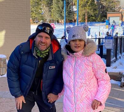 Picture of Ellie and her ski instructor